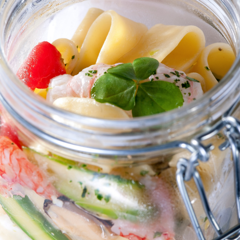 Calamarata with seafood and asparagus, cooked under glass